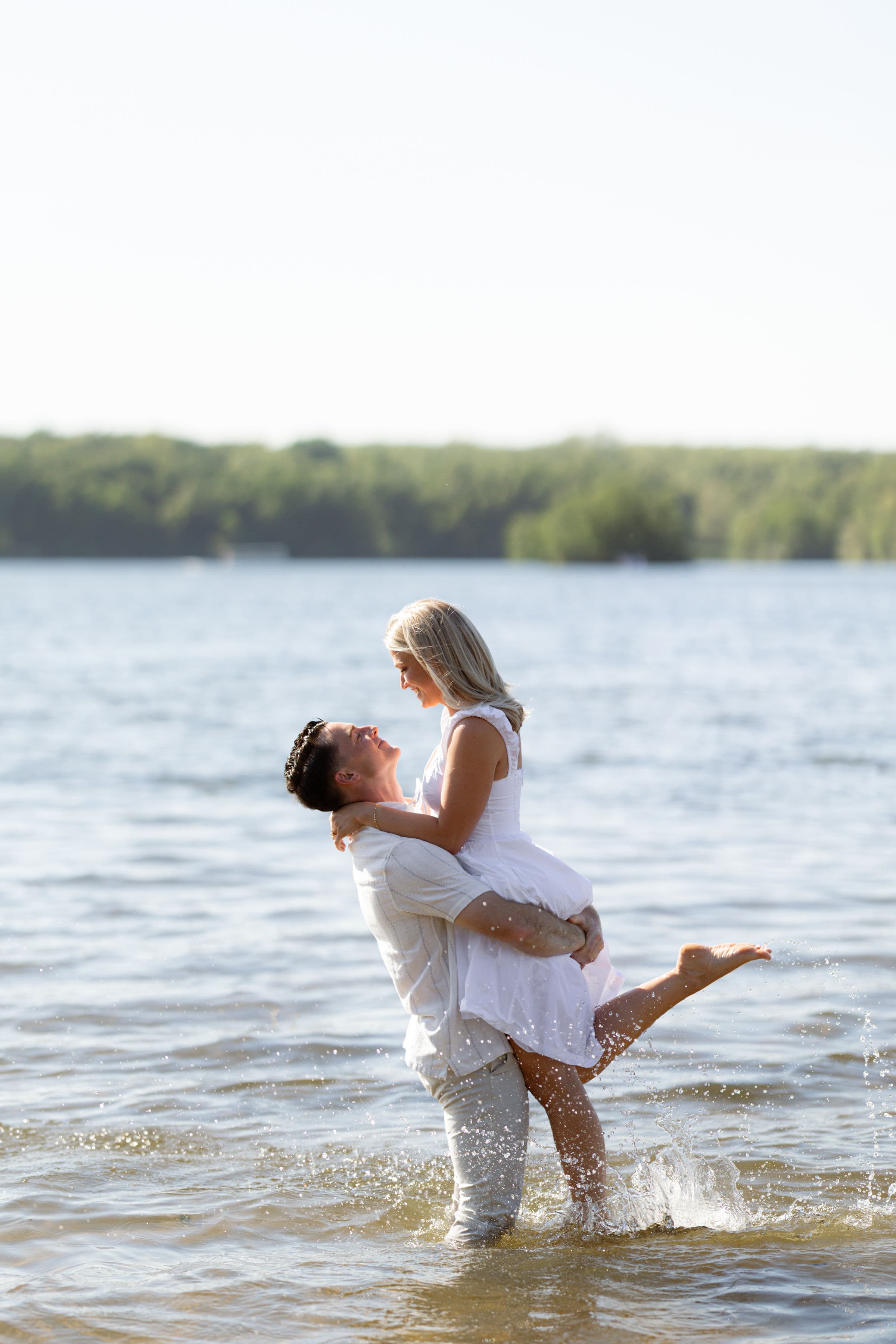 Jess and Allison celebrating together in the lake